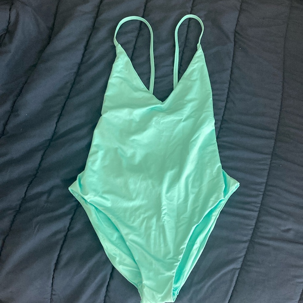 Trina Turk swim and spa collection “sky” color one piece. Size 12, NWT and liner
